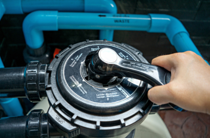 Pool filter handle being turned on.